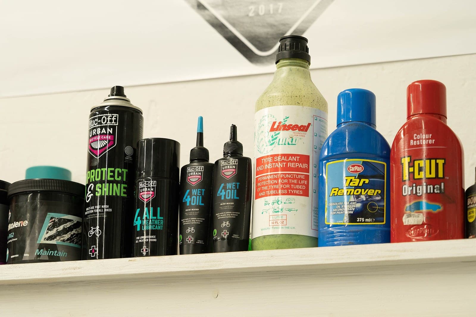 Full synthetic oils and workshop chemicals on the parts shelf