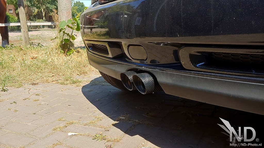 Twin rear tailpipes exiting a rear diffuser