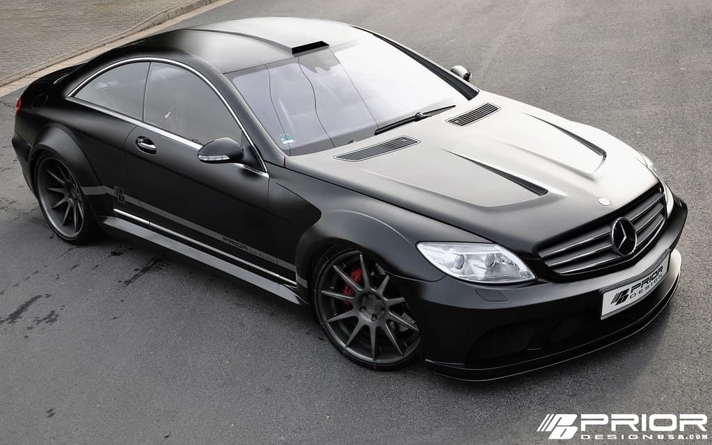Carbon fibre tailpipes under a black rear valance