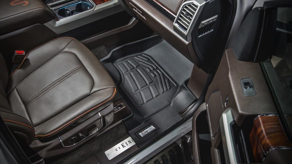 All-weather floor liner fitted in a truck footwell