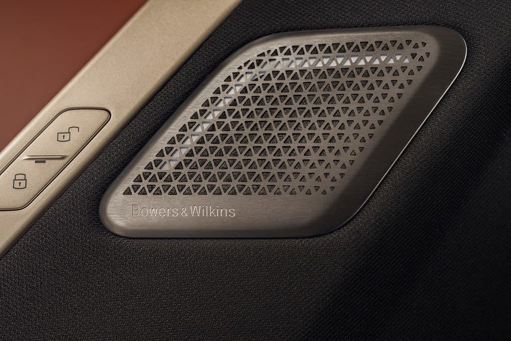 Factory-position speaker grille in a door card